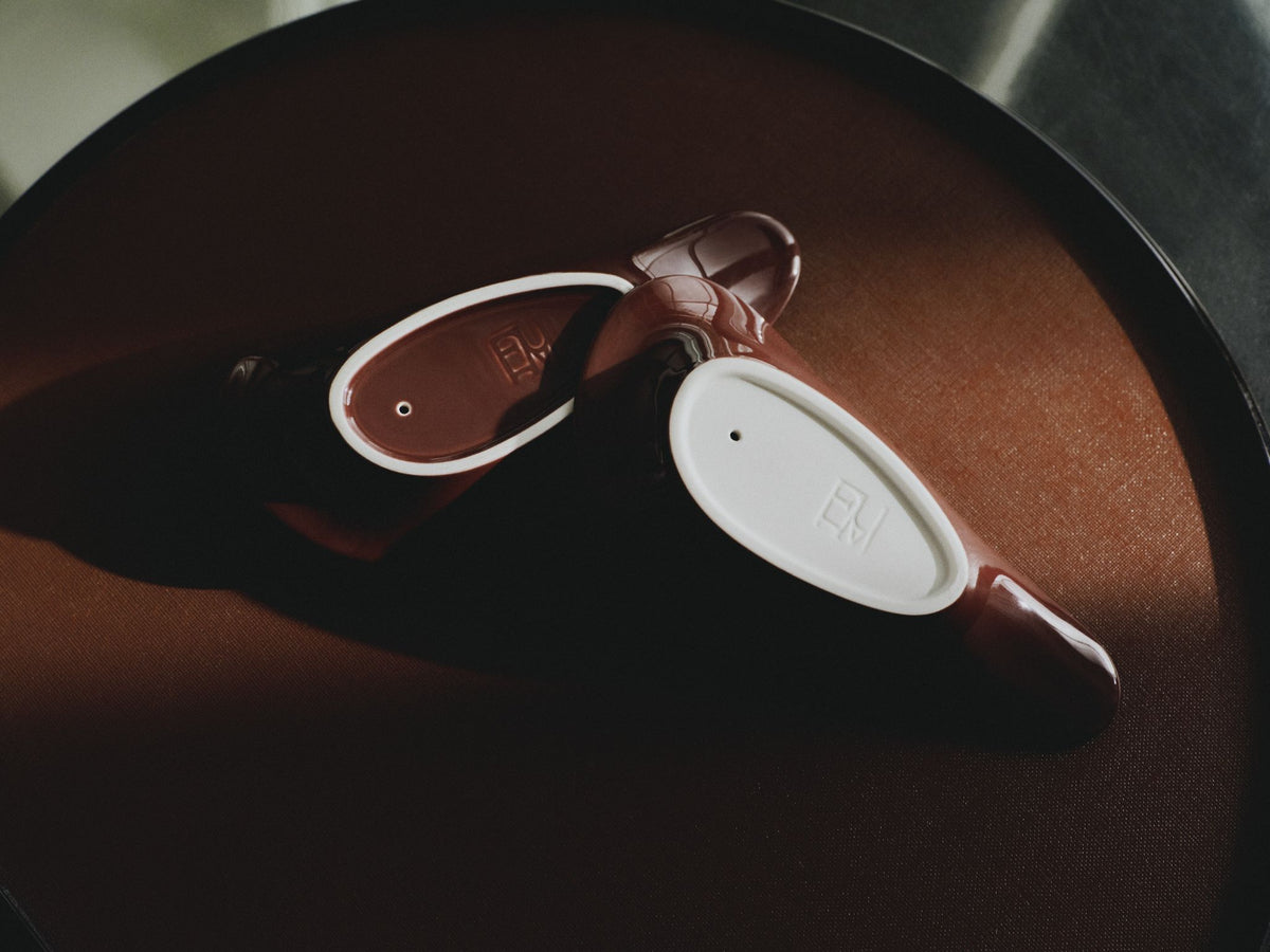Close-up detail of the glazed porcelain candle and incense holder